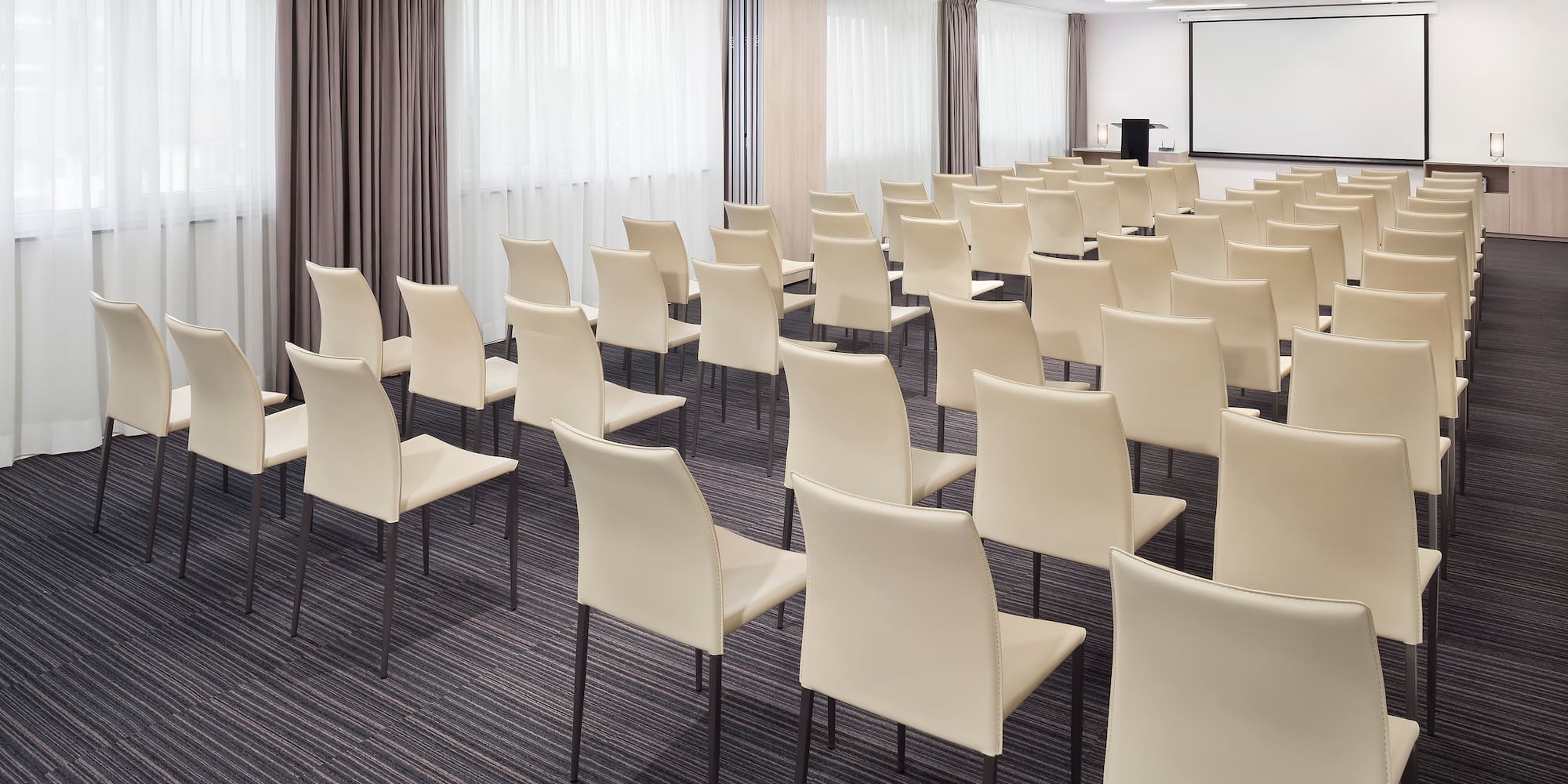 a room with white chairs