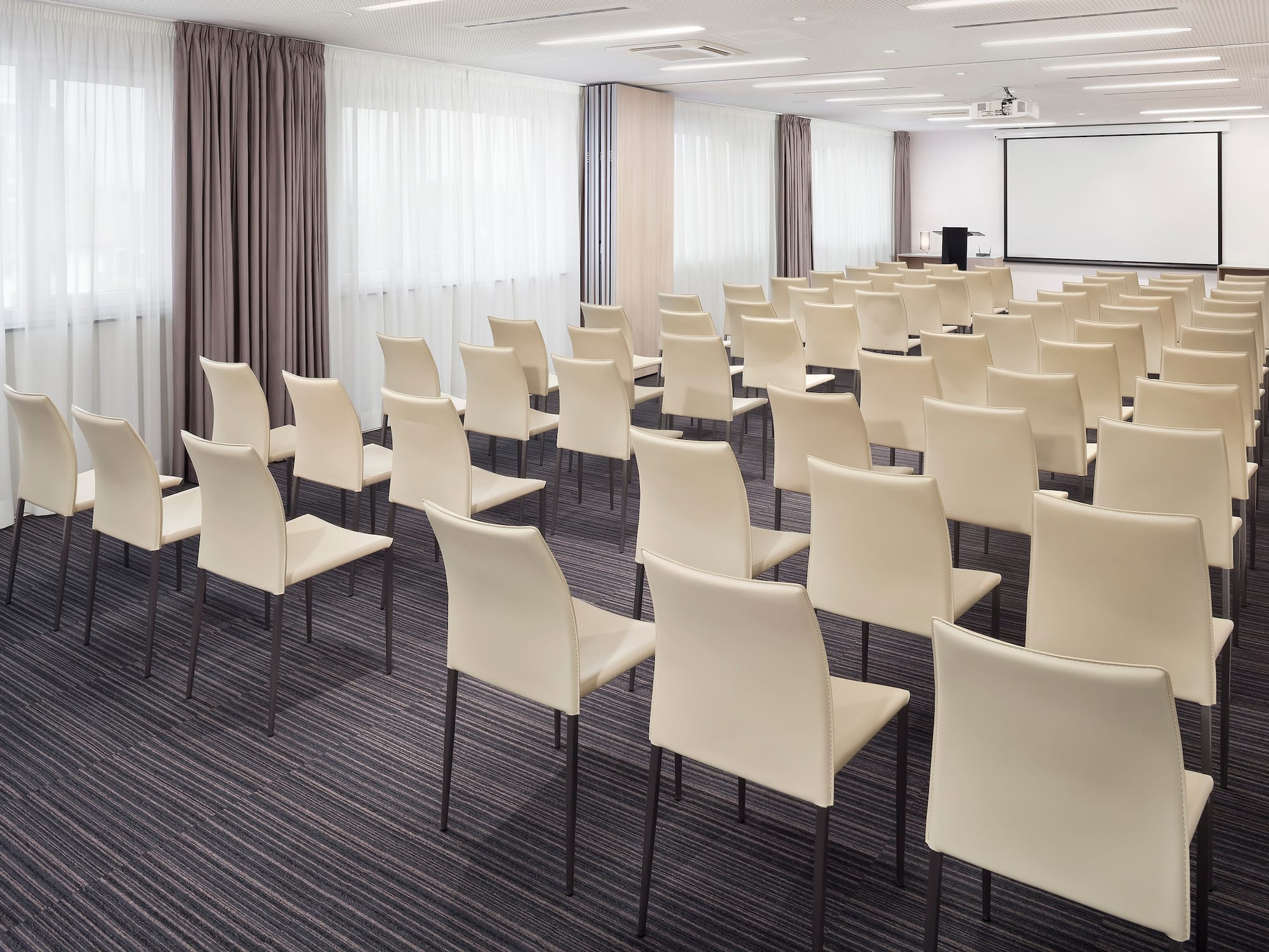 a room with white chairs