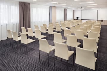 a room with white chairs