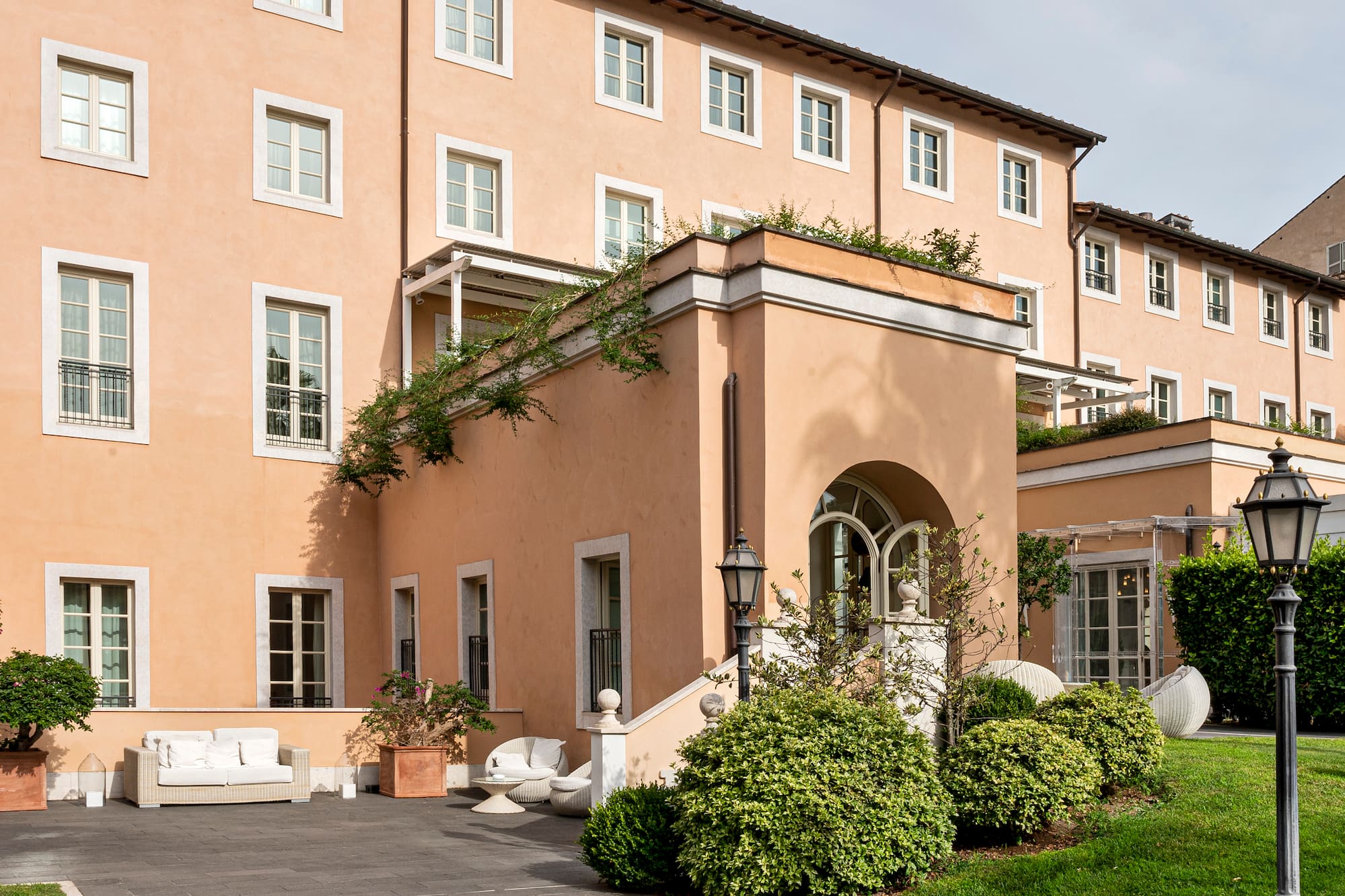 a building with a patio and a lawn