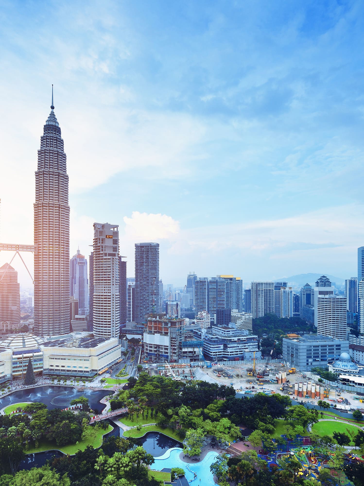 a city with tall buildings and a park