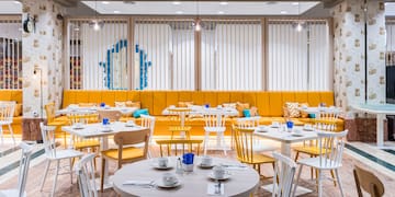 a room with tables and chairs