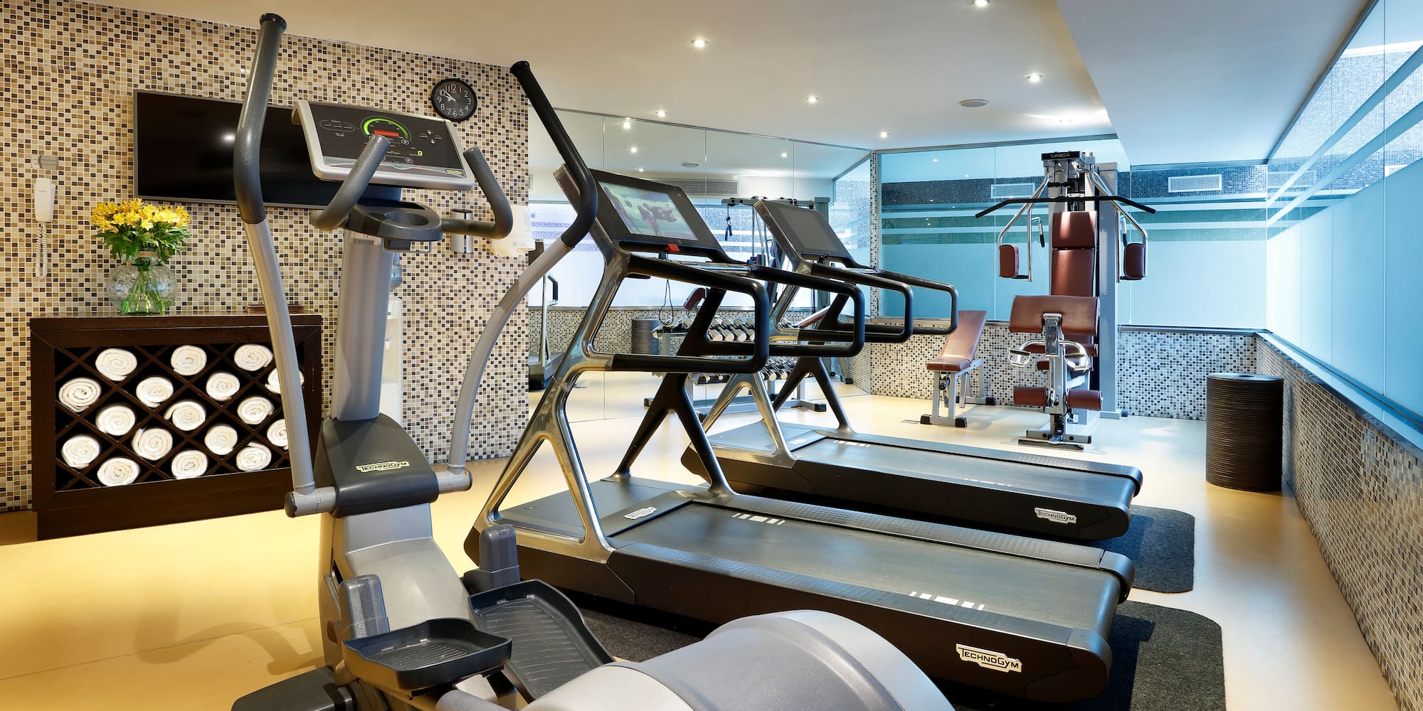 a room with treadmills and exercise equipment