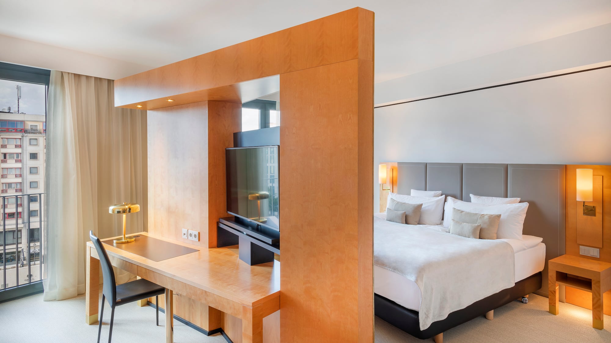 a room with a bed and a desk