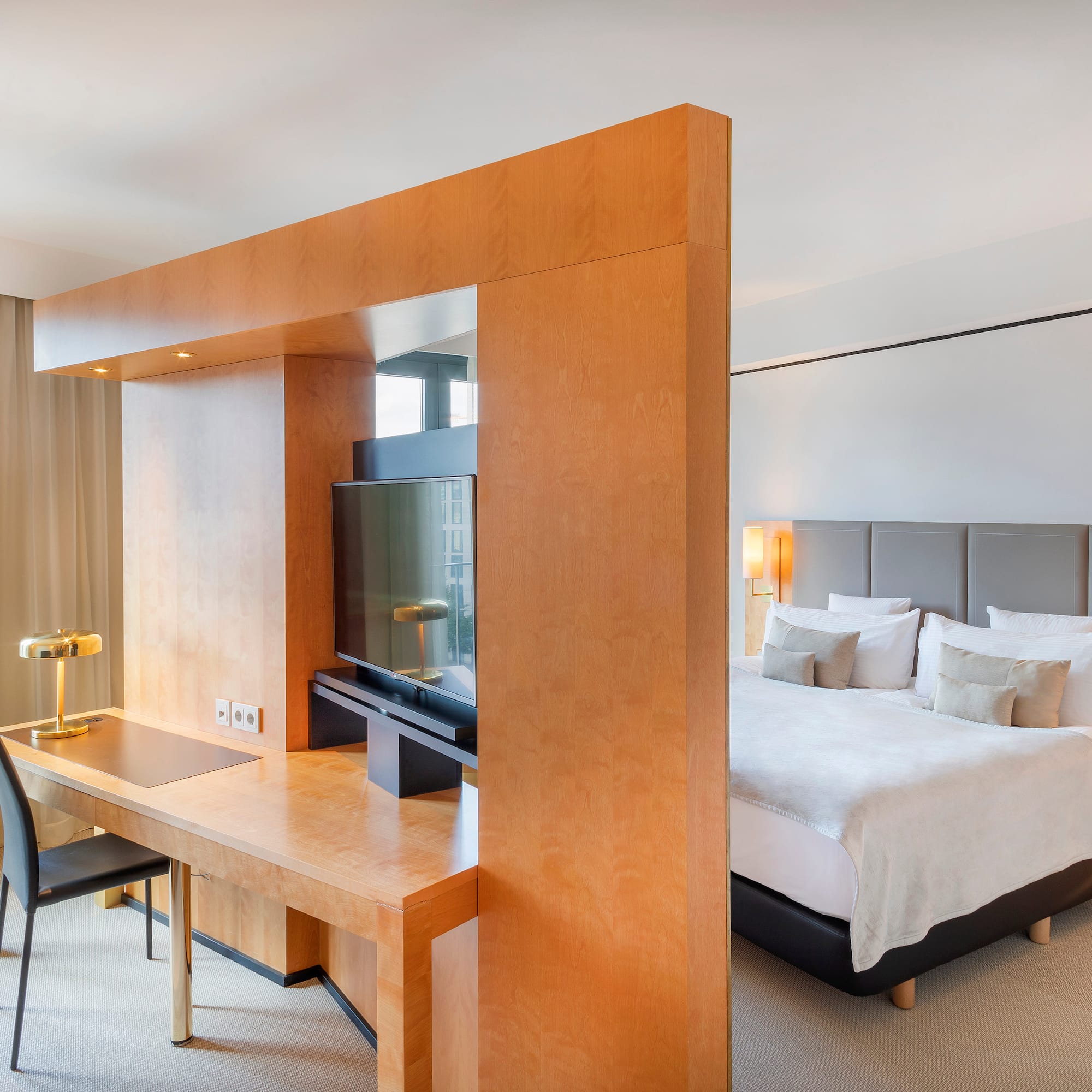 a room with a bed and a desk