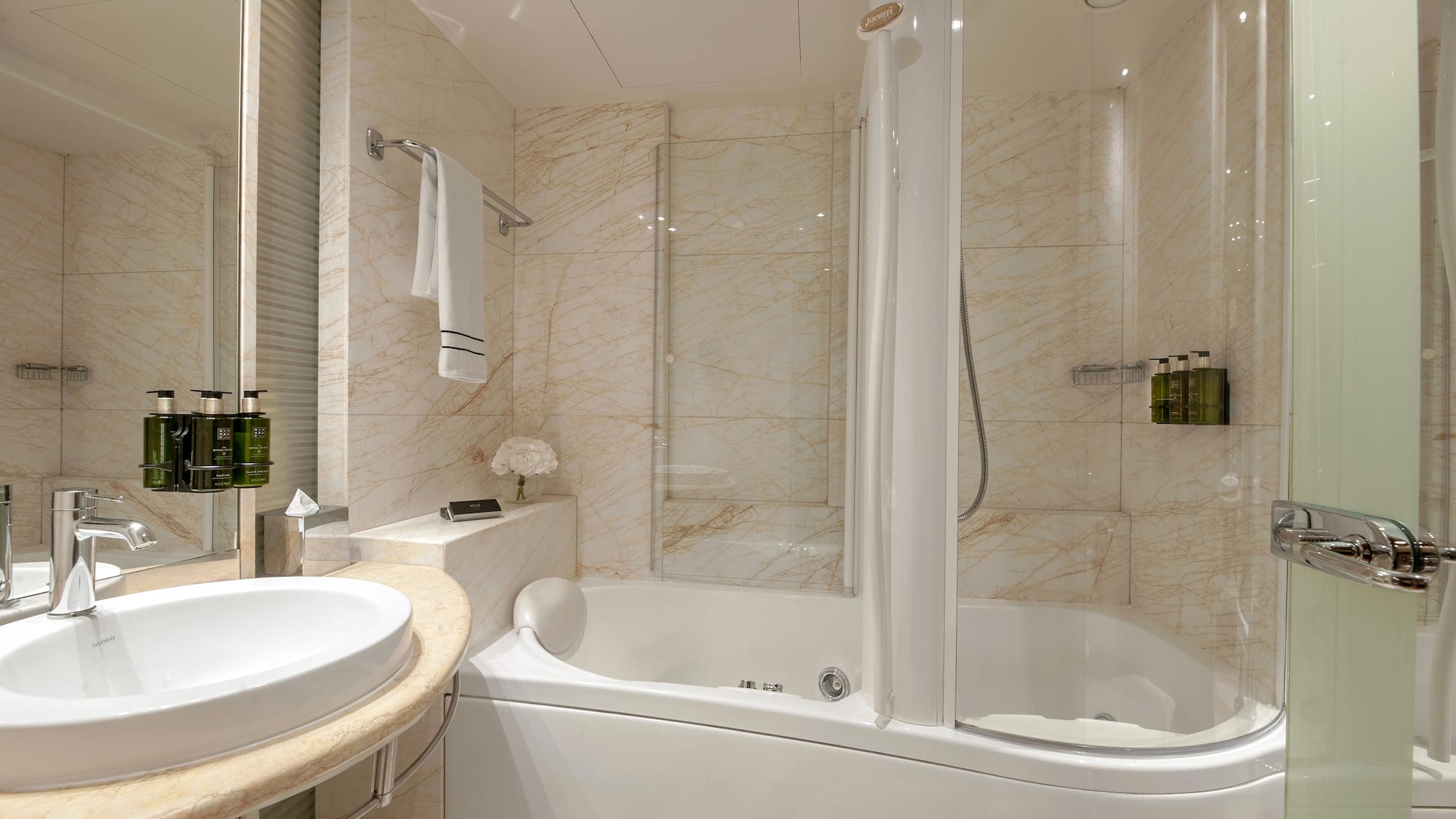 a bathroom with a tub and sink