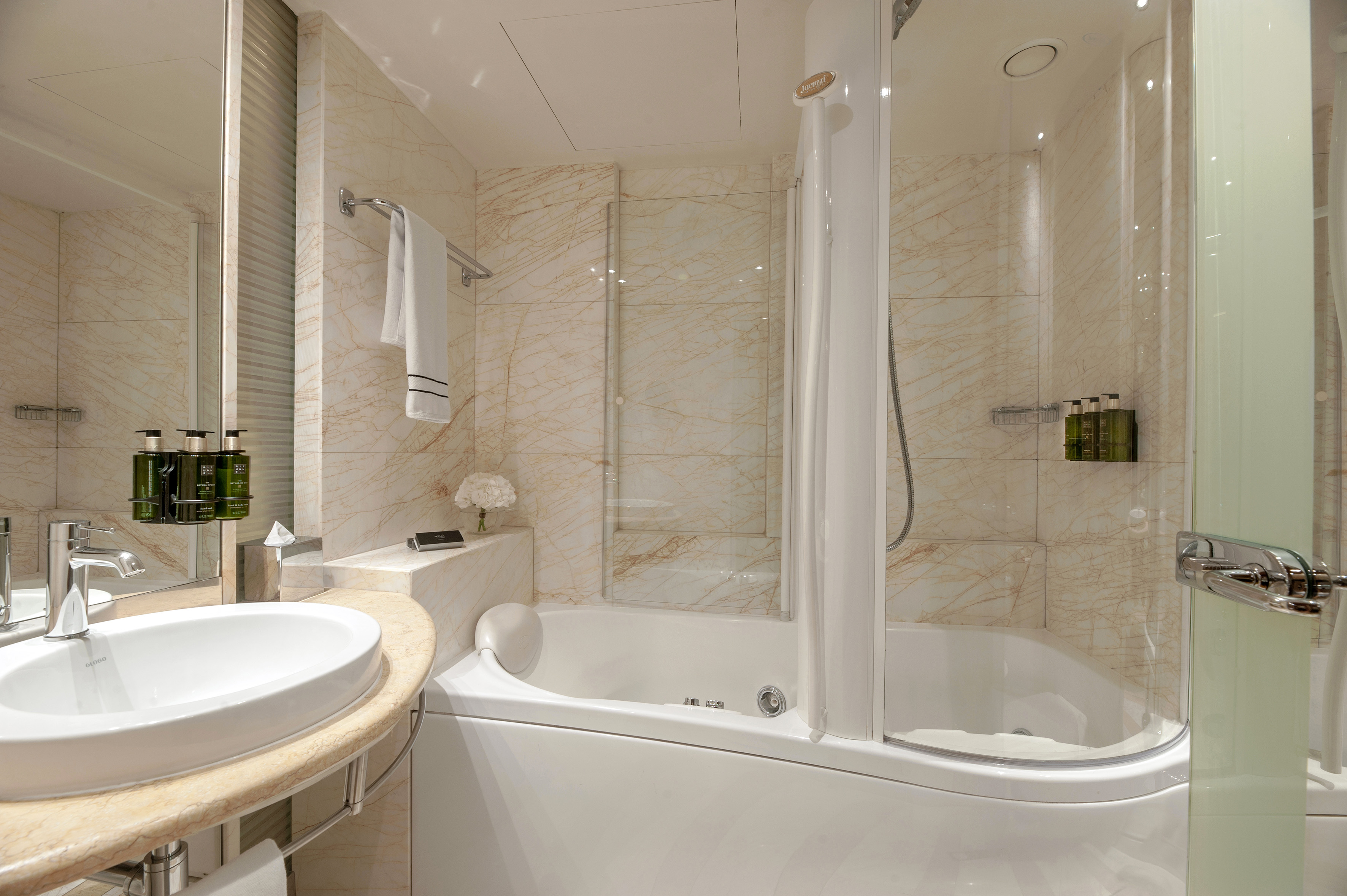 a bathroom with a tub and sink