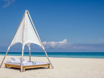 a bed on a beach
