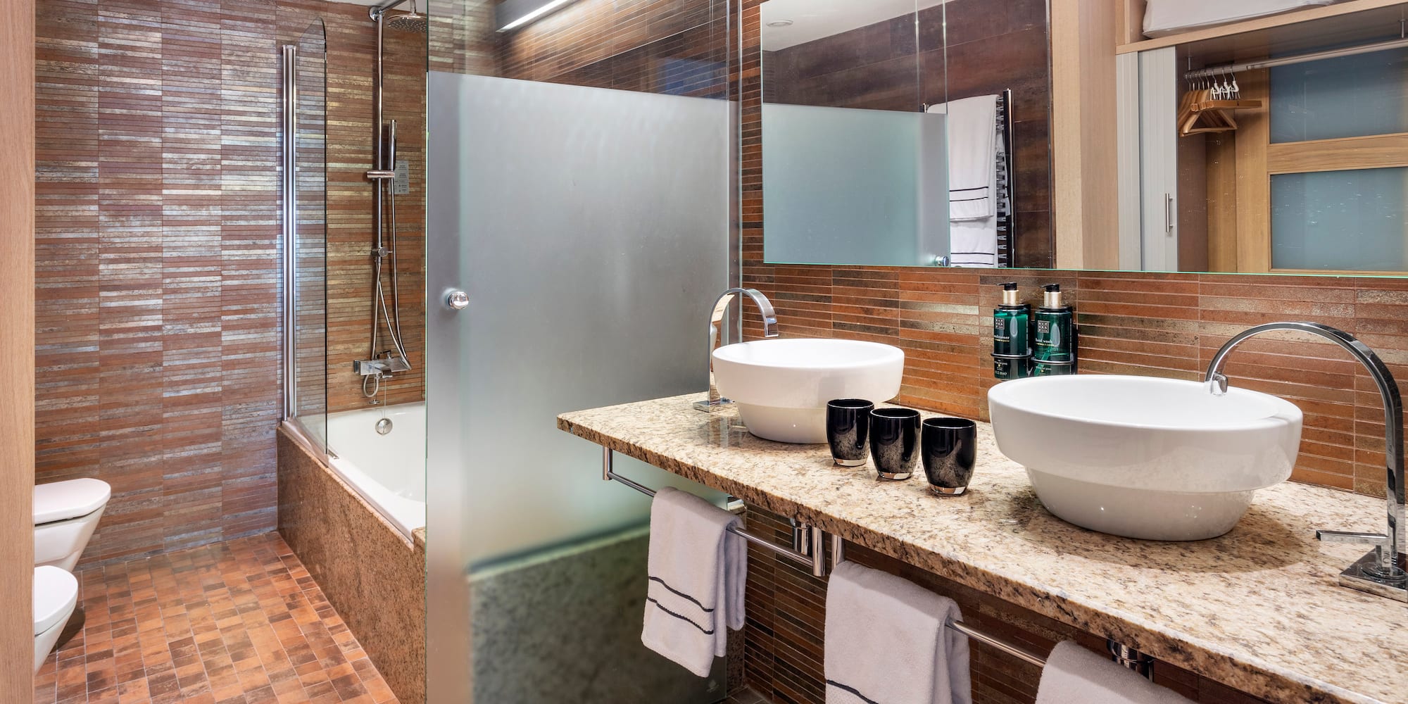 a bathroom with a shower and sink