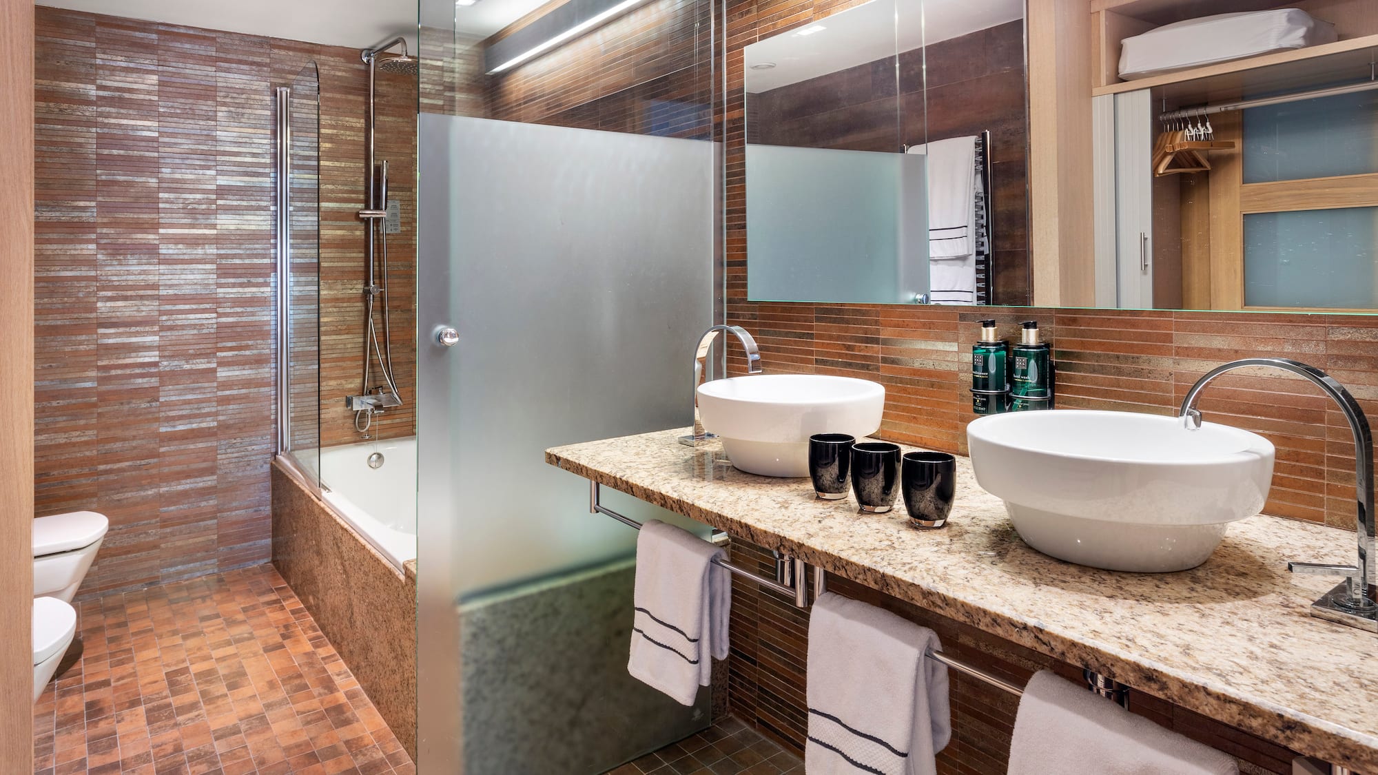 a bathroom with a shower and sink