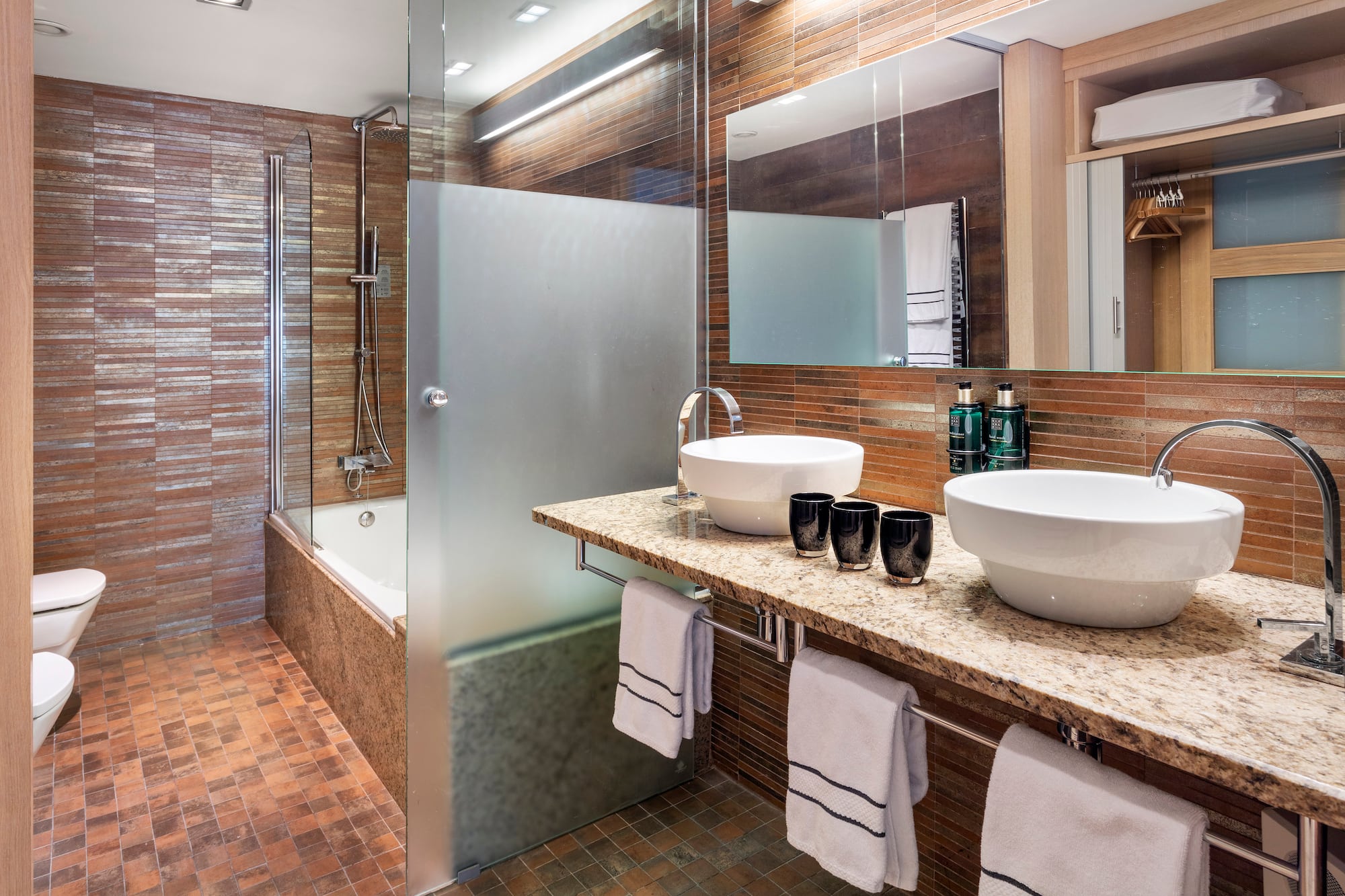 a bathroom with a shower and sink