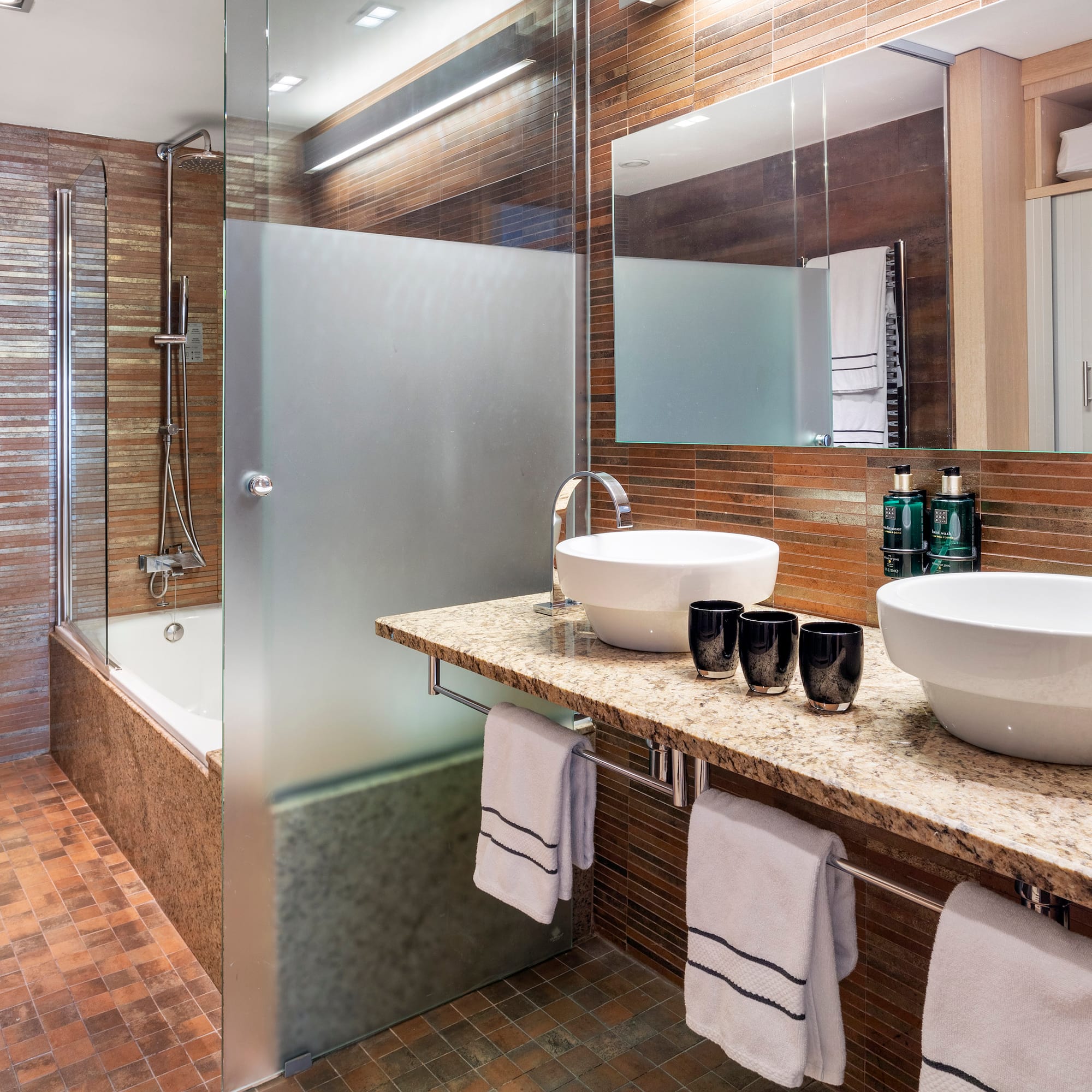 a bathroom with a shower and sink