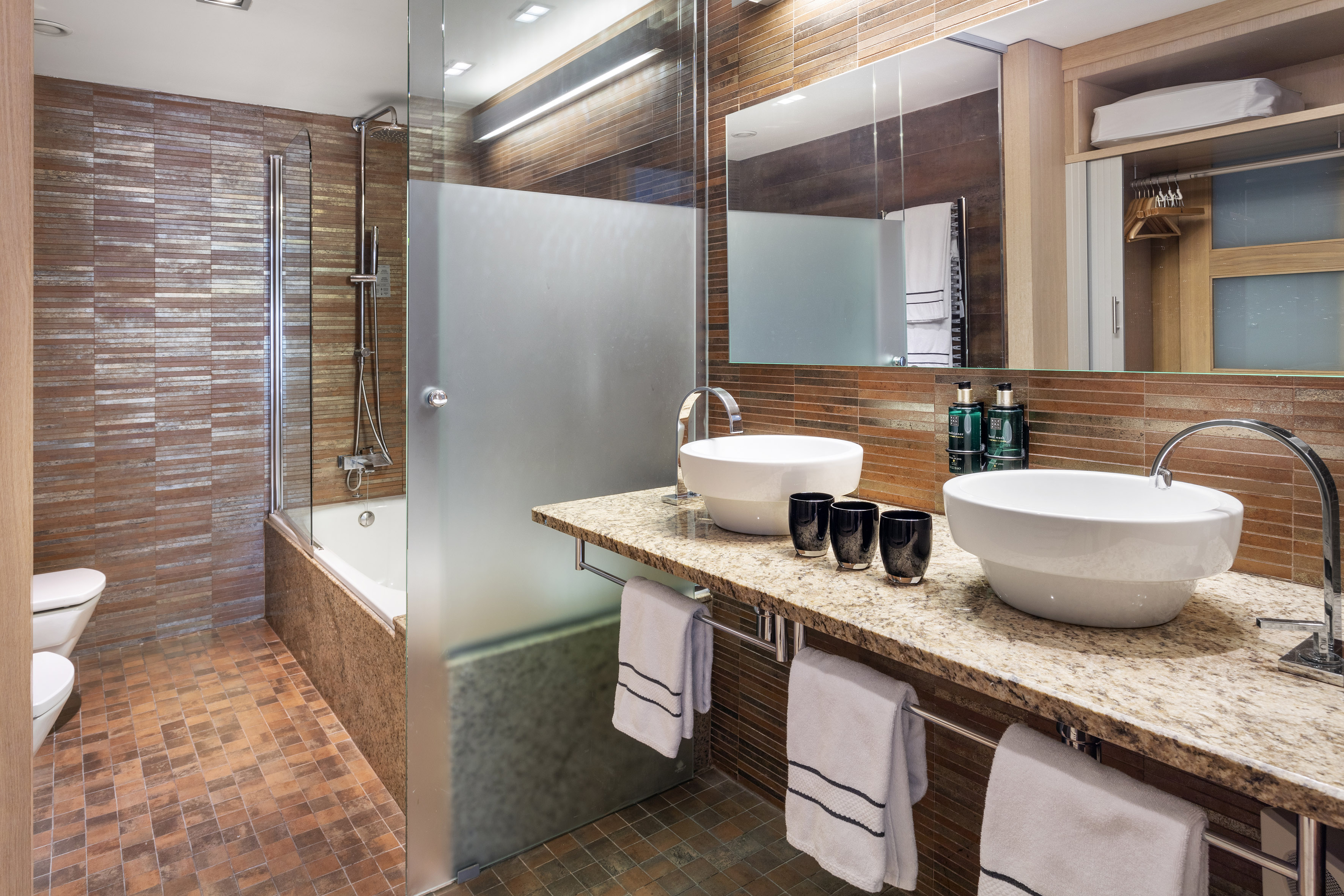 a bathroom with a shower and sink