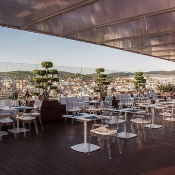 a restaurant with tables and chairs on a deck