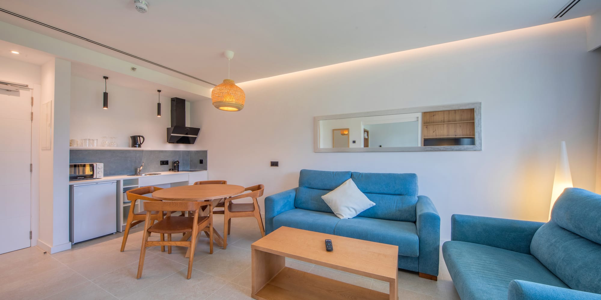 a living room with a table and couch