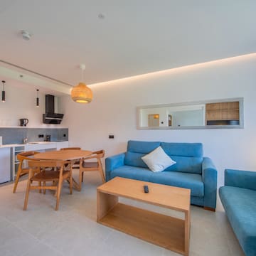 a living room with a table and couch