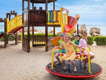 a group of kids on a playground