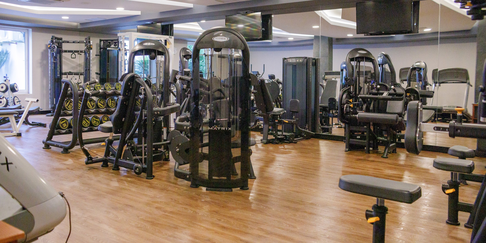 a gym with many exercise equipment