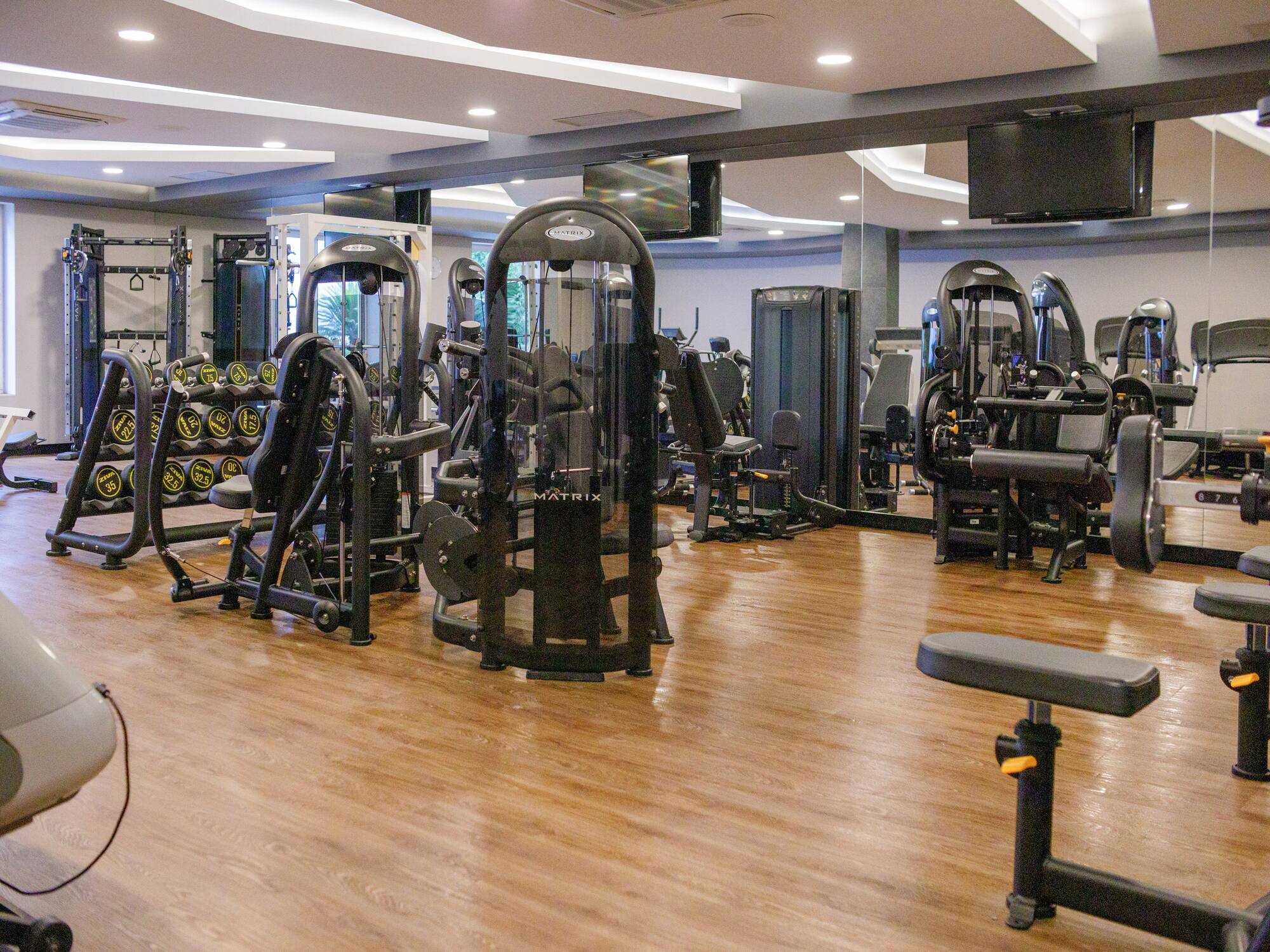 a gym with many exercise equipment
