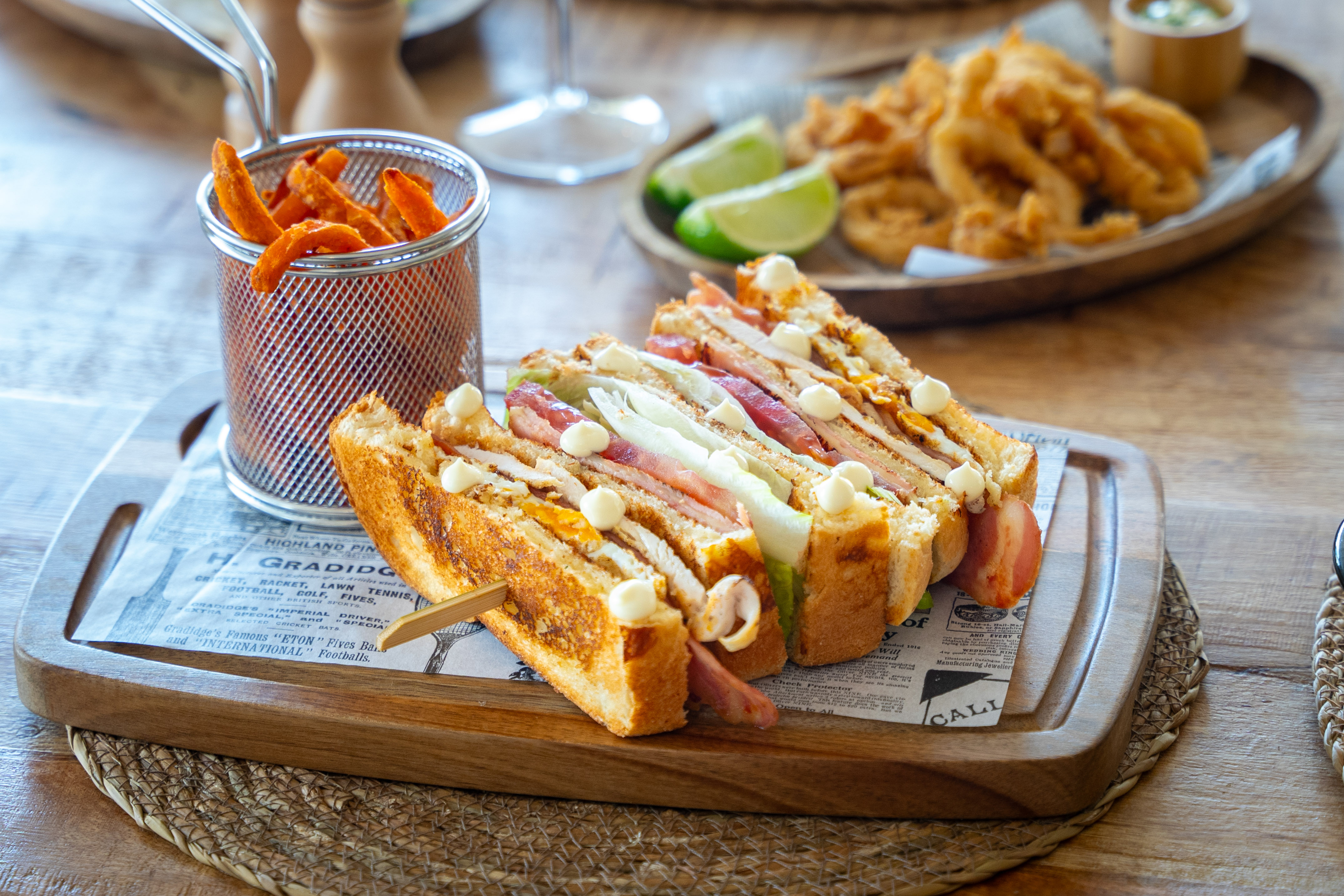 a sandwich on a wooden board