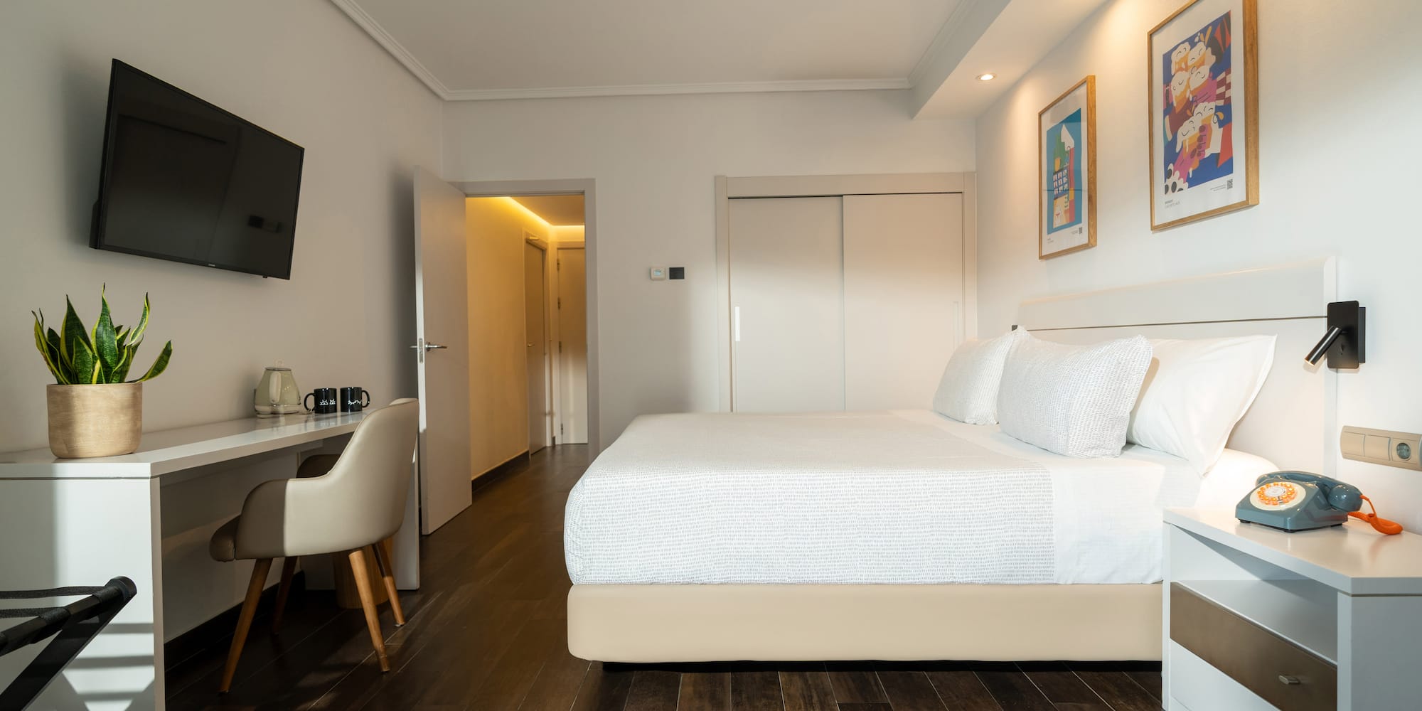 a bedroom with a bed and a desk