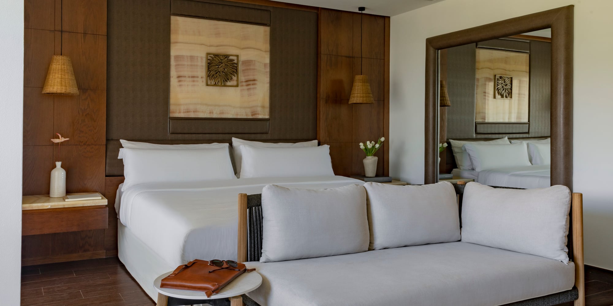 a room with a bed and a mirror