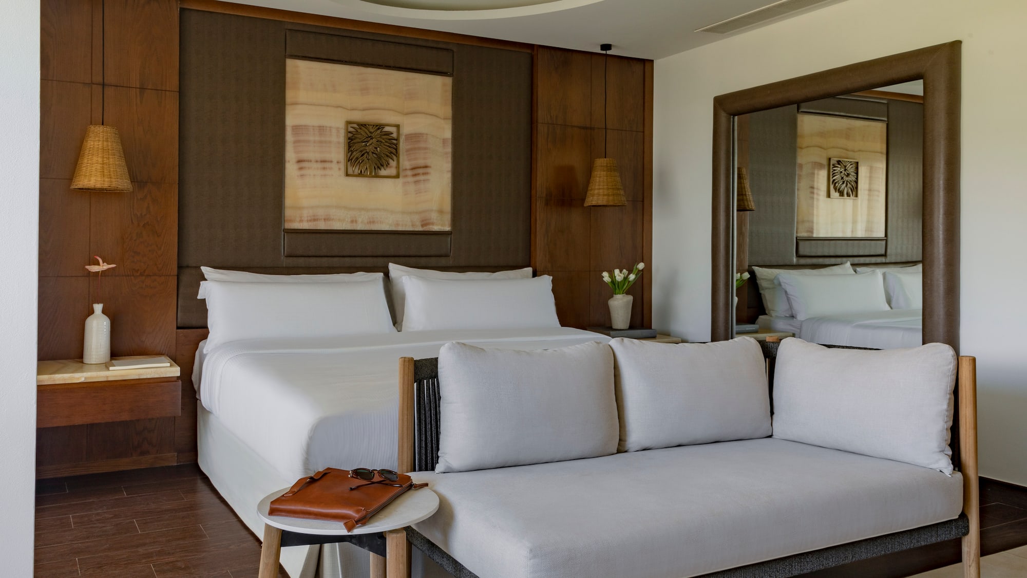 a room with a bed and a mirror