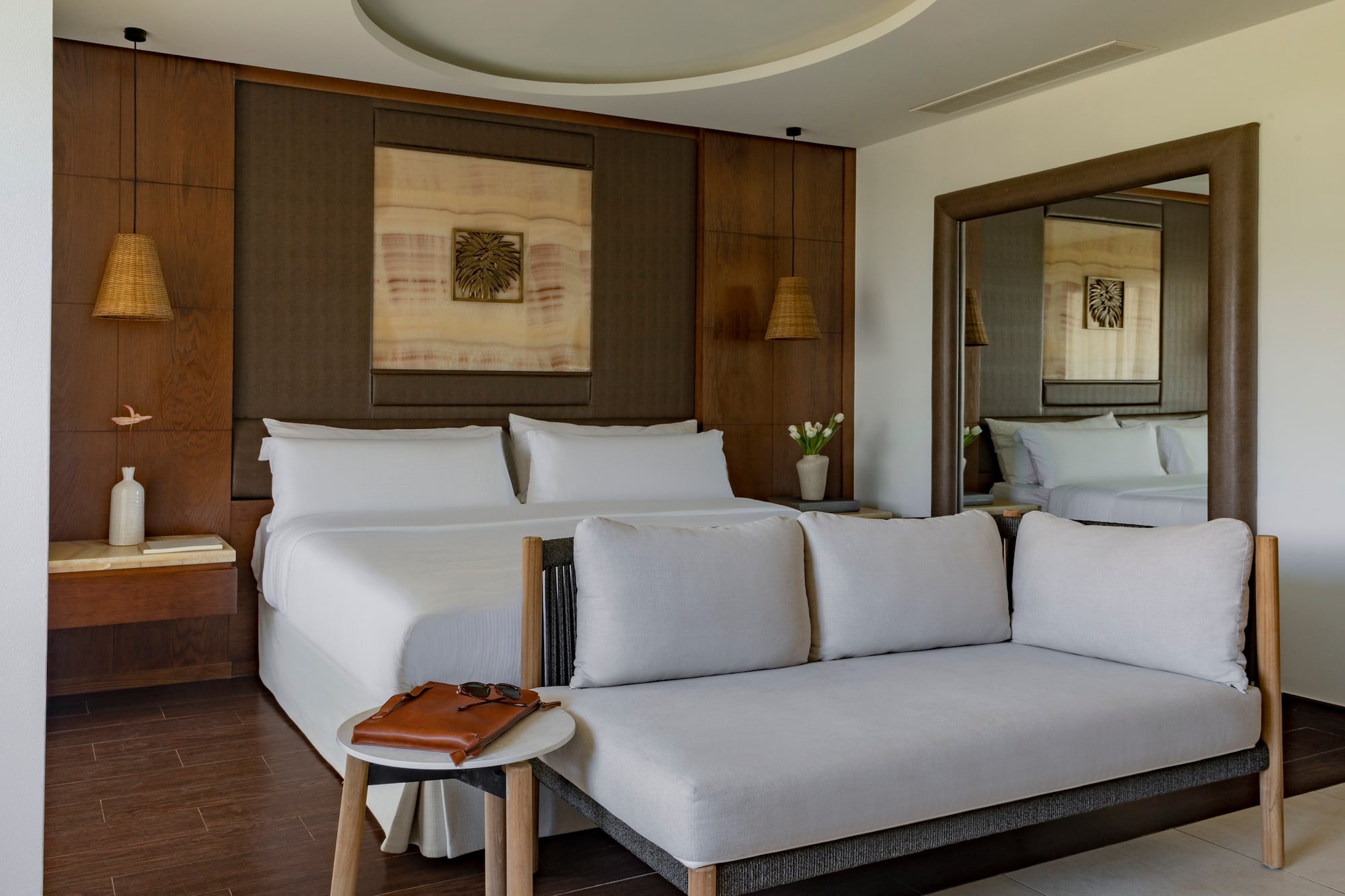 a room with a bed and a mirror