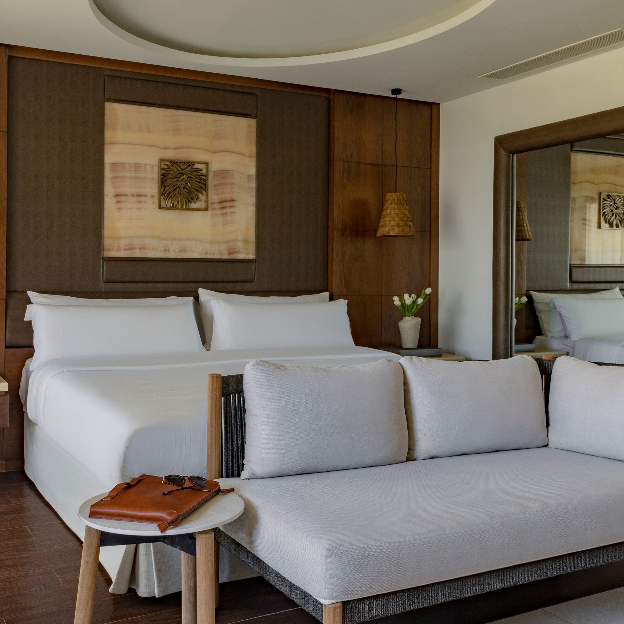 a room with a bed and a mirror