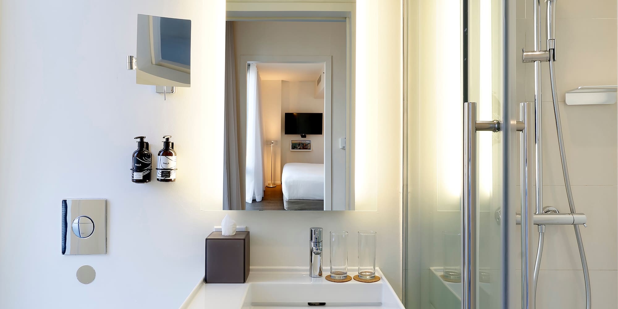 a bathroom with a mirror and a sink