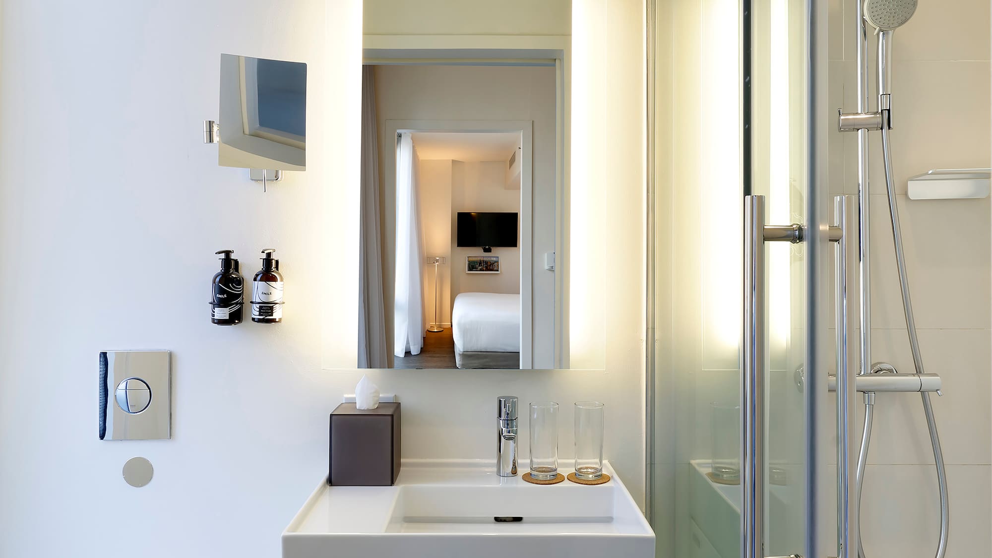 a bathroom with a mirror and a sink