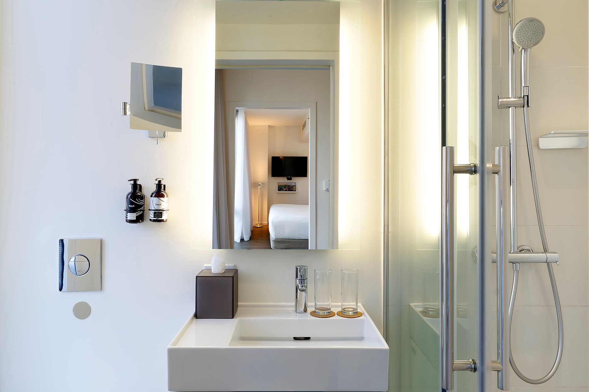 a bathroom with a mirror and a sink