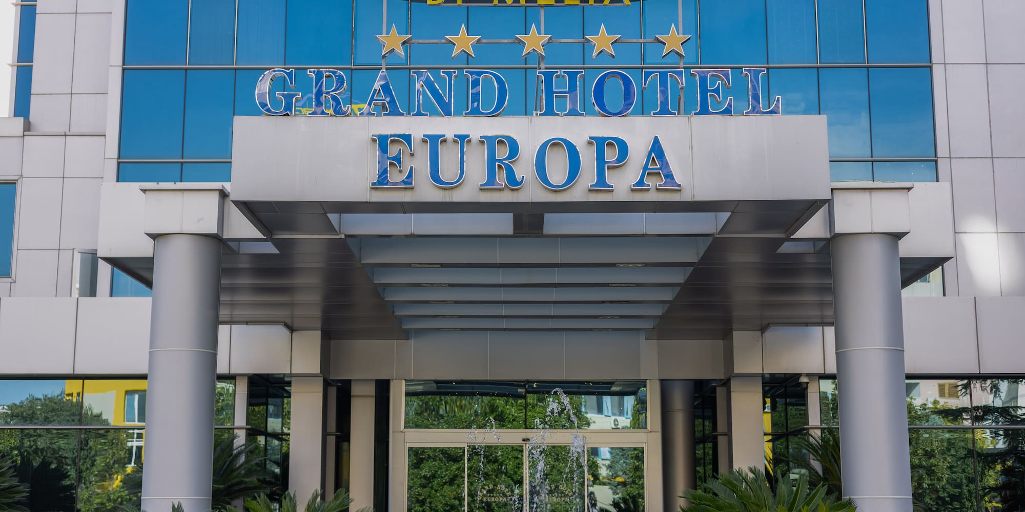 a building with glass walls and a sign