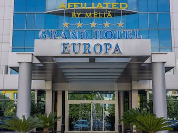 a building with glass walls and a sign