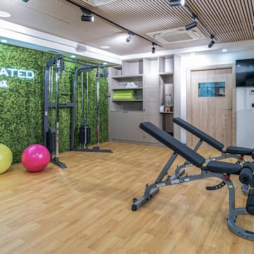 a gym with exercise equipment and exercise balls