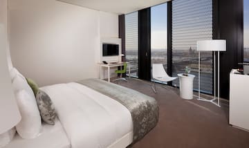 a bedroom with a bed and a desk and chair