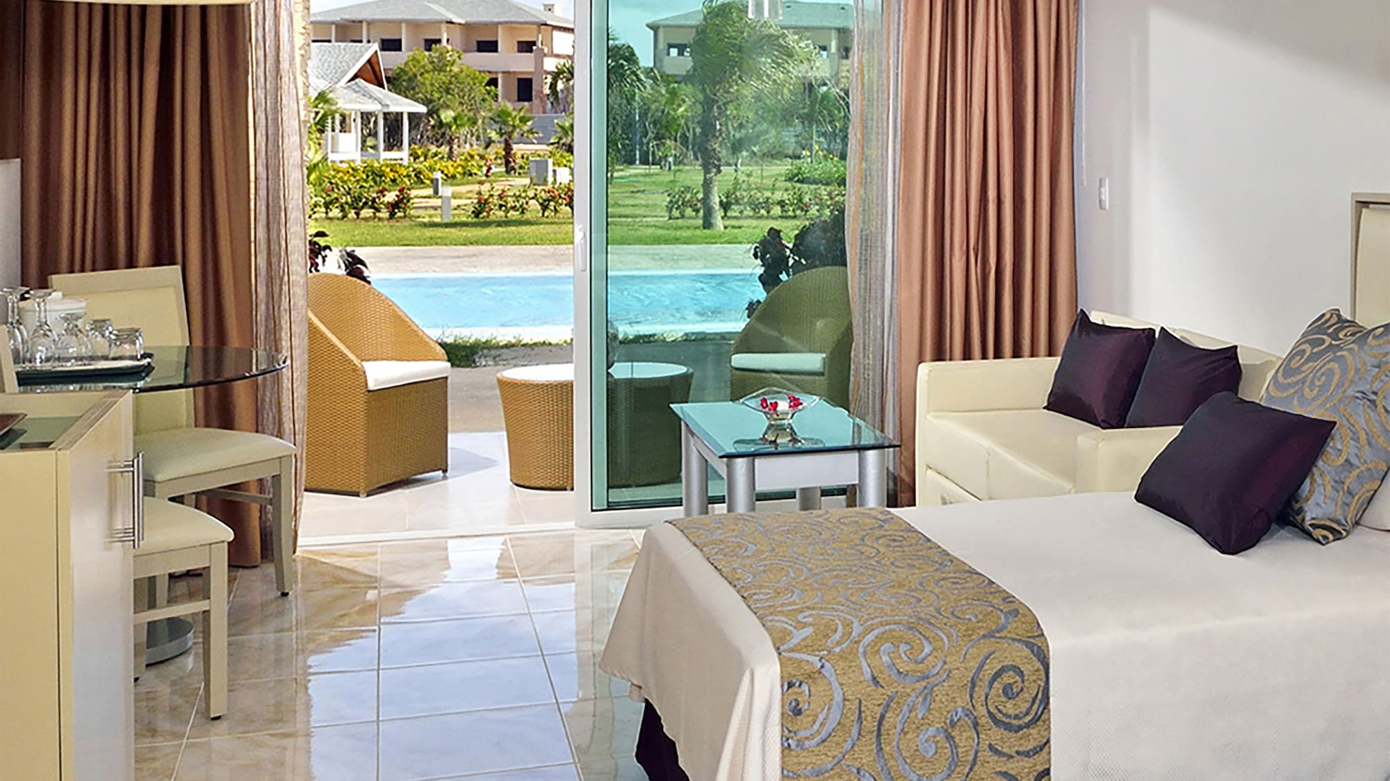 a room with two beds and a pool in the background