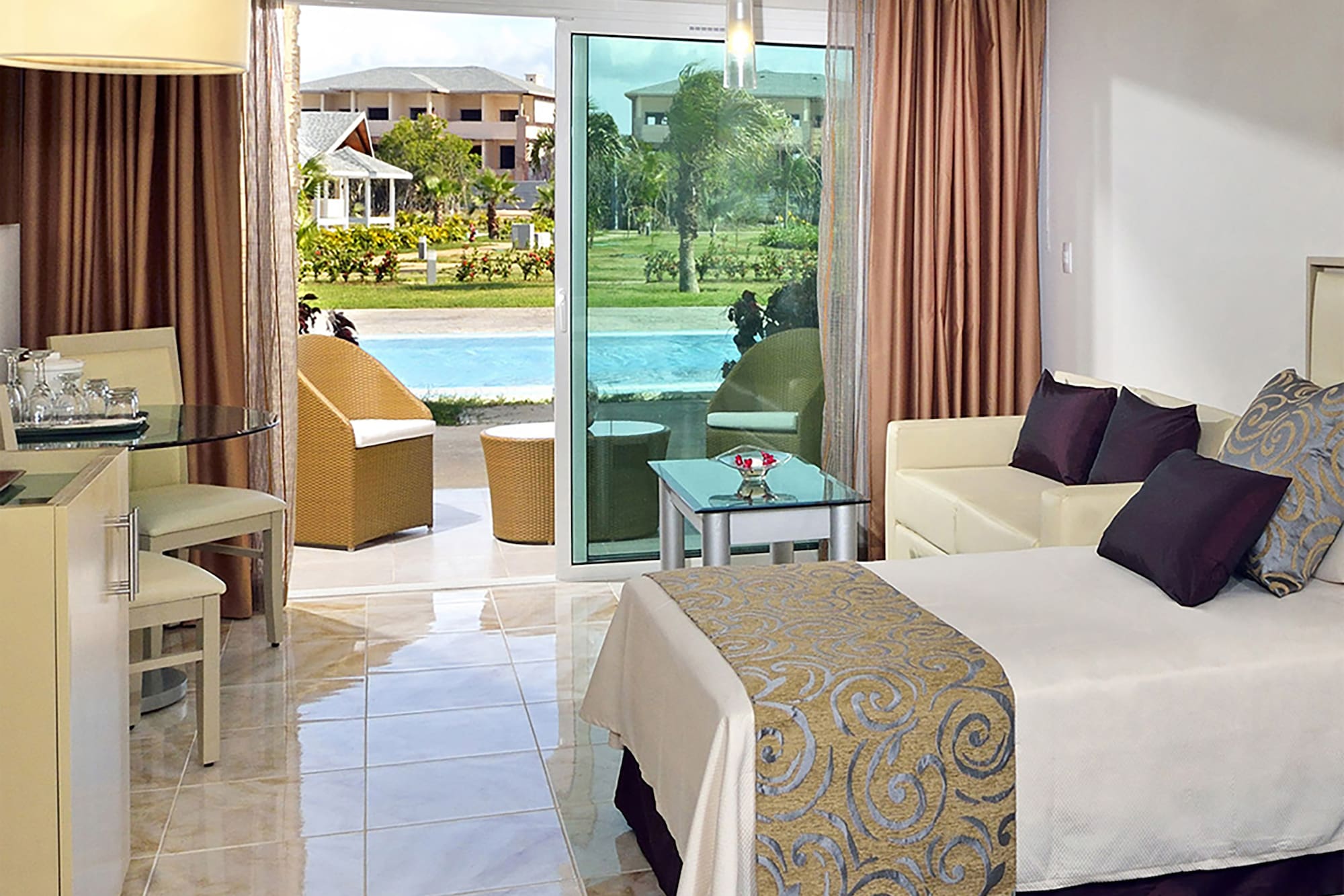 a room with two beds and a pool in the background