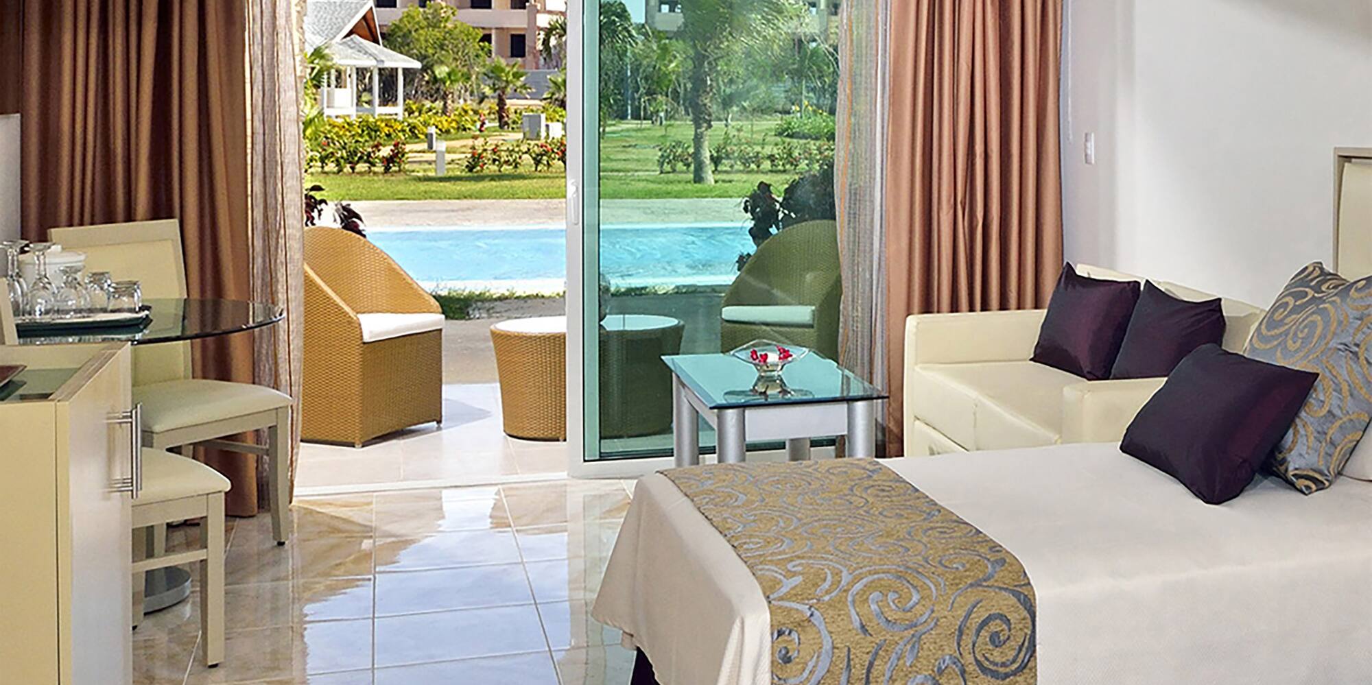 a room with two beds and a pool in the background