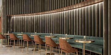 a room with a row of tables and chairs