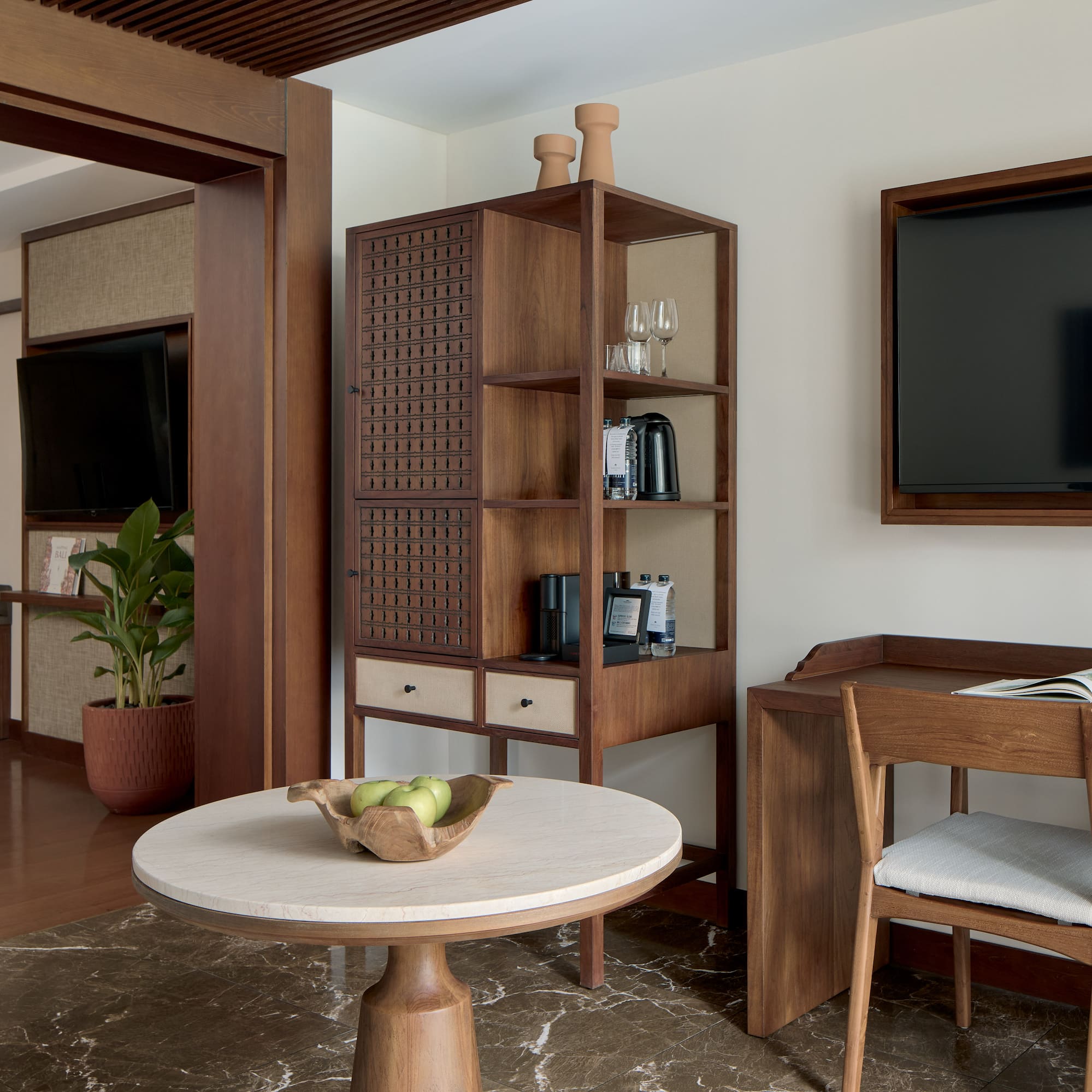 a room with a tv and a table