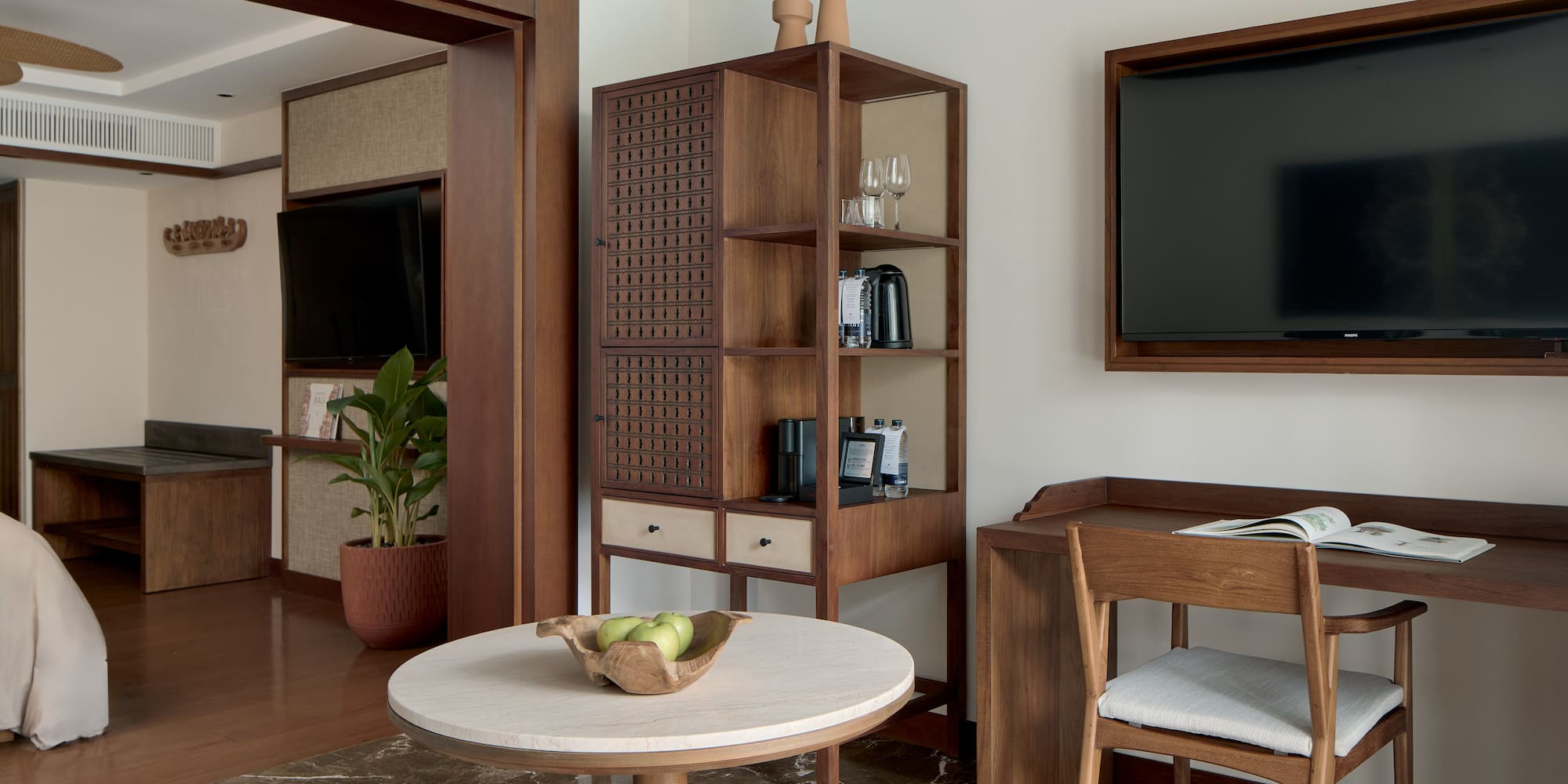 a room with a tv and a table