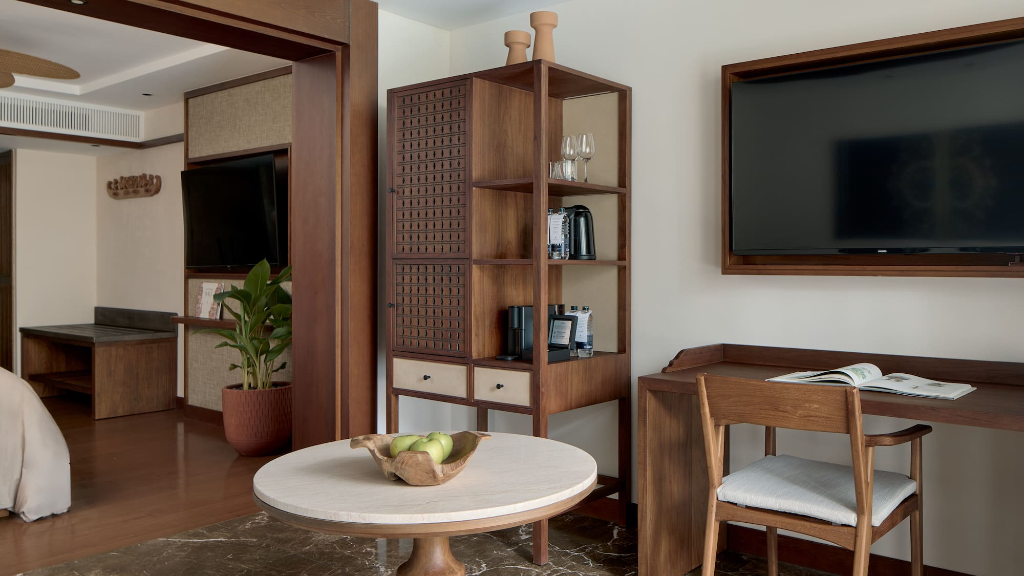 a room with a tv and a table