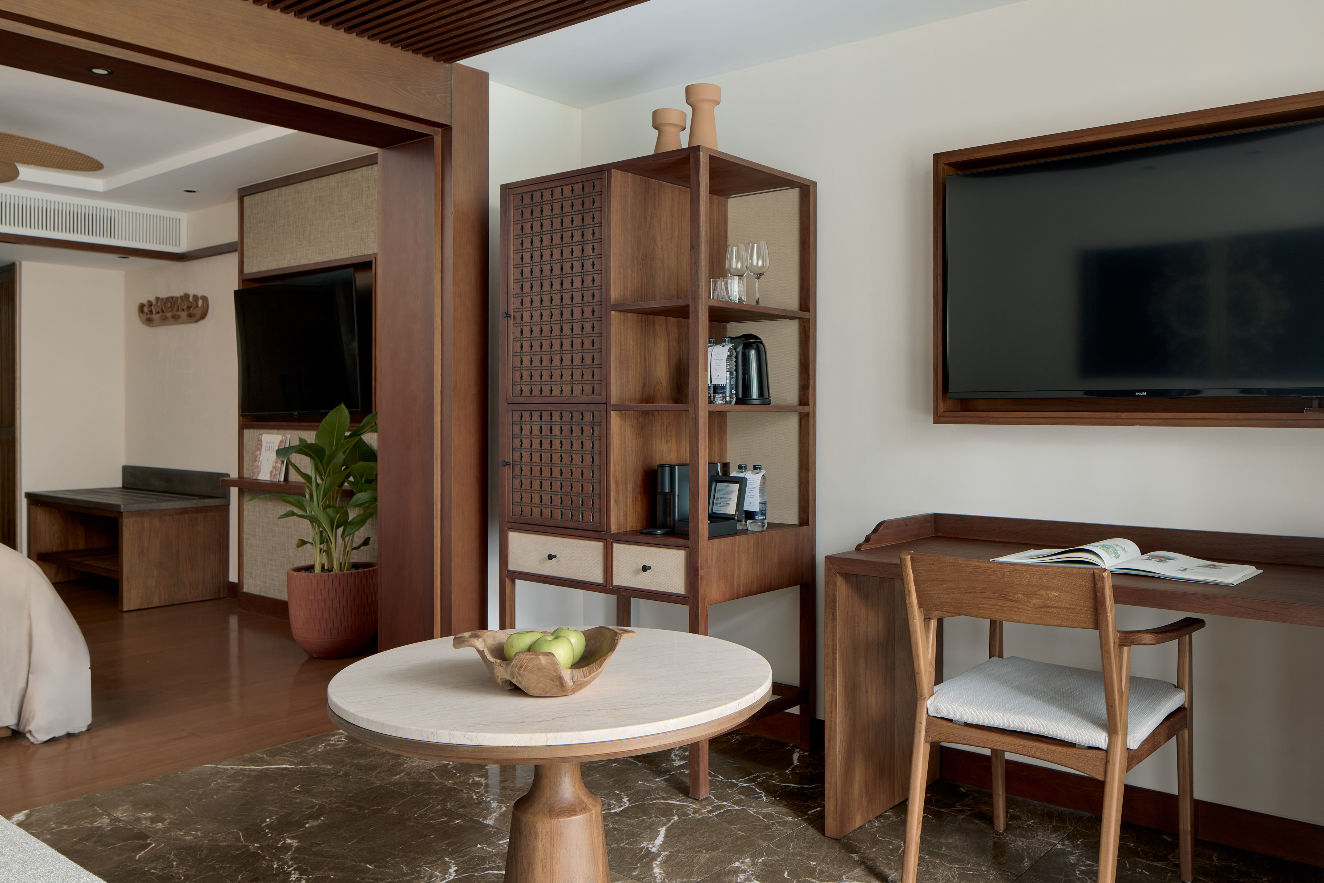 a room with a tv and a table