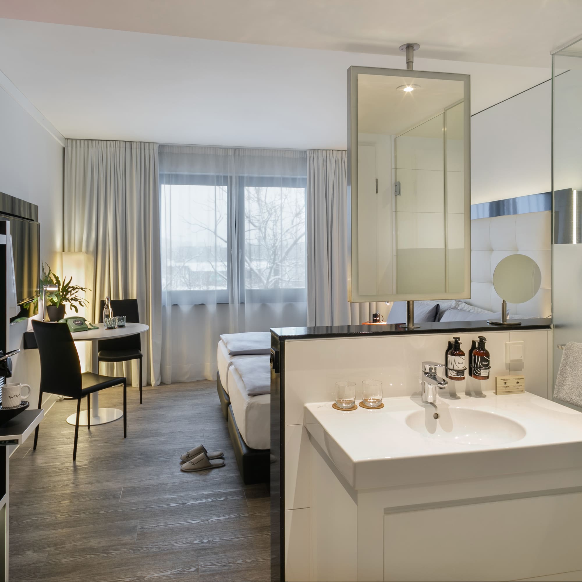 a room with a bed and a mirror