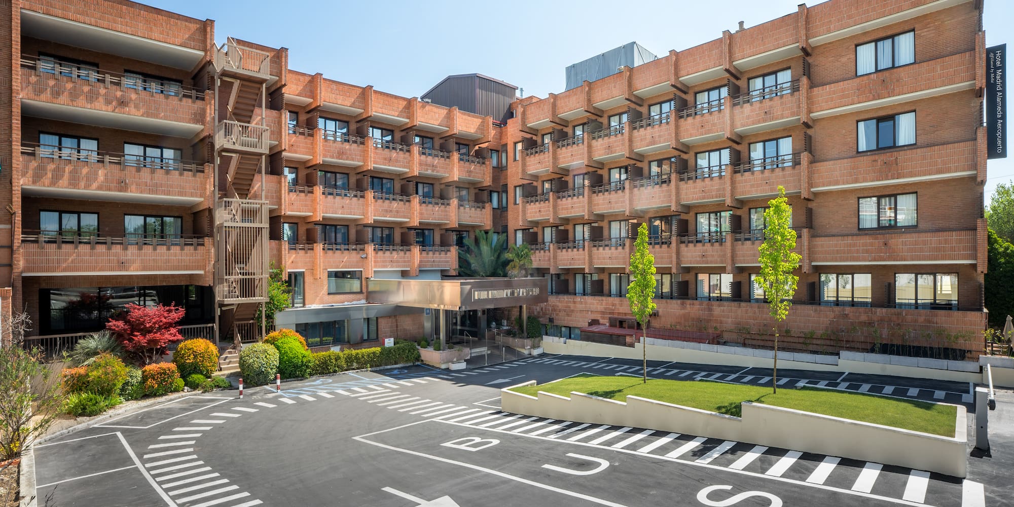 a building with a parking lot and a parking lot