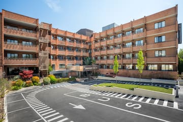 a building with a parking lot and a parking lot