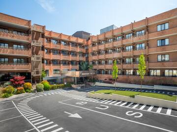 a building with a parking lot and a parking lot