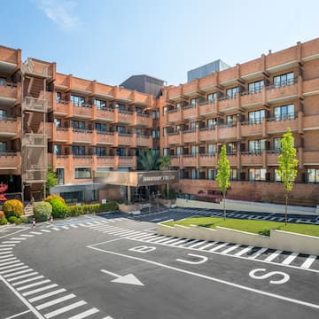 a building with a parking lot and a parking lot