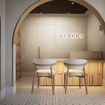 a room with a table and chairs